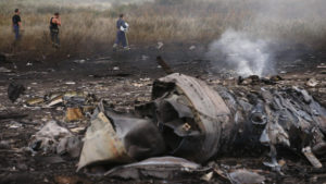 Emergencies Ministry members walk at the site of a Malaysia Airlines Boeing 777 plane crash near the settlement of Grabovo in the Donetsk region, July 17, 2014. The Malaysian airliner Flight MH-17 was brought down over eastern Ukraine on Thursday, killing all 295 people aboard and sharply raising the stakes in a conflict between Kiev and pro-Moscow rebels in which Russia and the West back opposing sides.    REUTERS/Maxim Zmeyev (UKRAINE - Tags: TRANSPORT DISASTER POLITICS CIVIL UNREST) - RTR3Z3QS