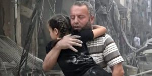 2016429162954760449181_A-man-carries-a-child-after-airstrikes-hit-Aleppo-
