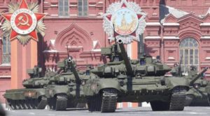 Russian servicemen drive T-90 tanks during a rehearsal for the Victory Day parade in Red Square in central Moscow, Russia