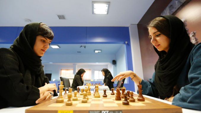 Iranian women take part in a chess tournament in Tehran last October. Dorsa Derakhshani was banned from playing for Iran for not wearing a hijab. Photograph: Atta Kenare/AFP/Getty Images